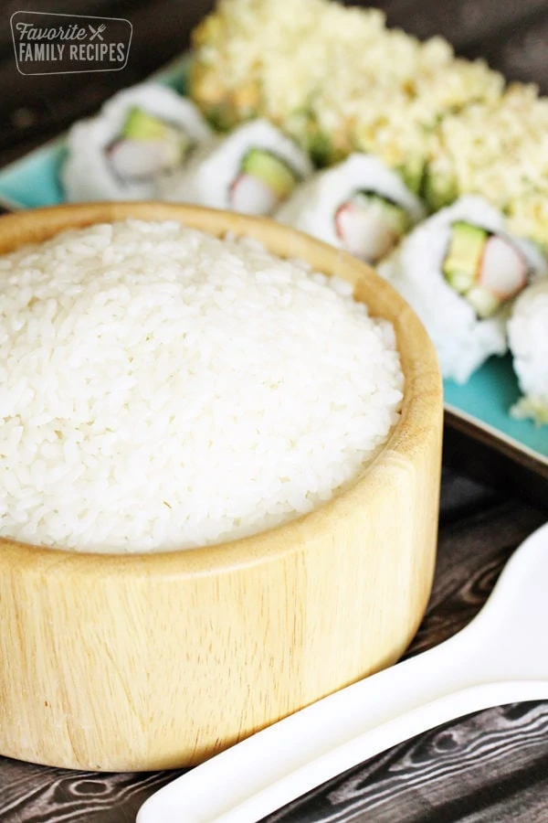 Bowl of sushi rice with California Roll and Sushi Roll