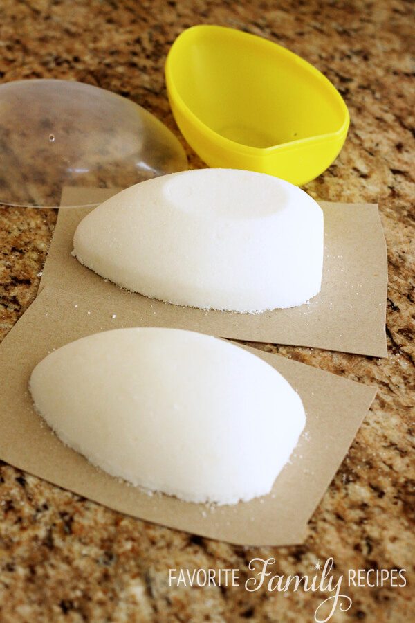 Two firmly packed sugar eggs made from egg mold