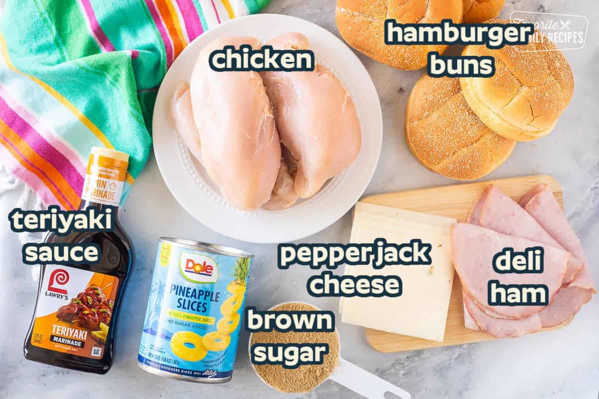 Ingredients to make Teriyaki Chicken Sandwich including chicken breasts, ham, pepper jack cheese, brown sugar, pineapple slices, teriyaki sauce and buns.
