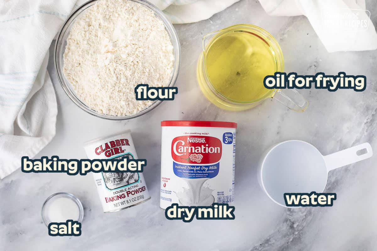 Ingredients to make Fry Bread including flour, baking powder, salt, dry milk, water and oil.