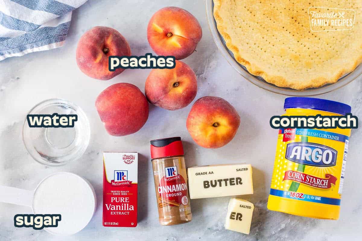 Ingredients to make the best peach pie including pie crust, corn starch, butter, cinnamon, vanilla, sugar, water, and peaches.