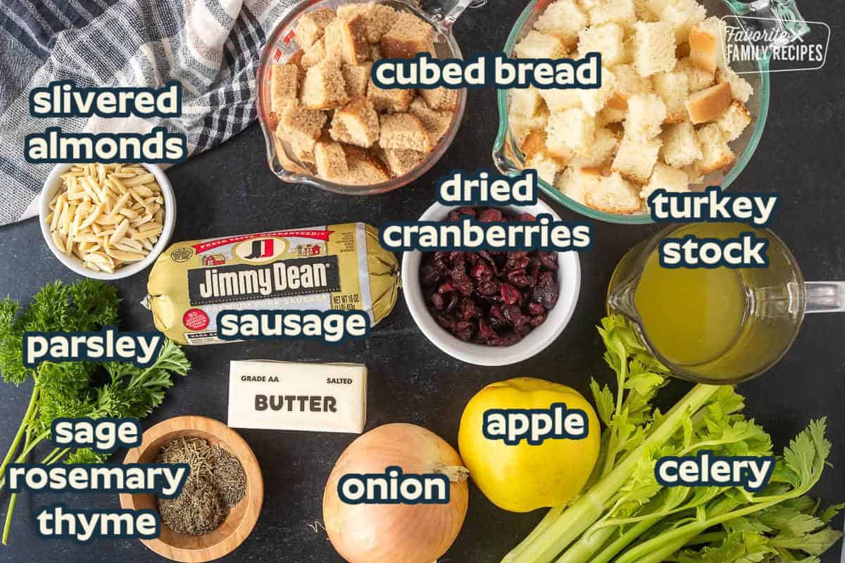 Cranberry and Sausage Stuffing ingredients including sage sausage, dried cranberries, turkey stock, dried bread cubes, onion, celery, seasonings.
