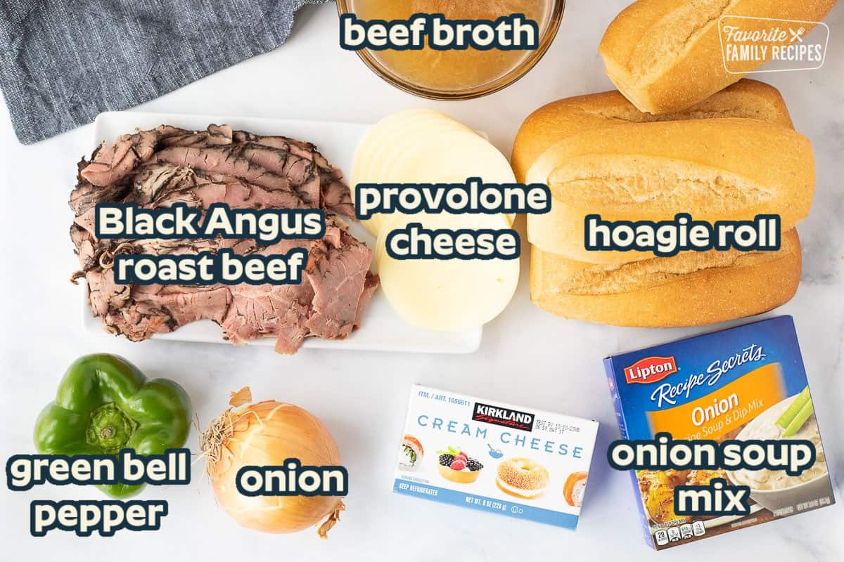 Philly Cheesesteak ingredients including rolls, beef broth, roast beef, provolone cheese, cream cheese, onion soup mix, green bell pepper and onion.
