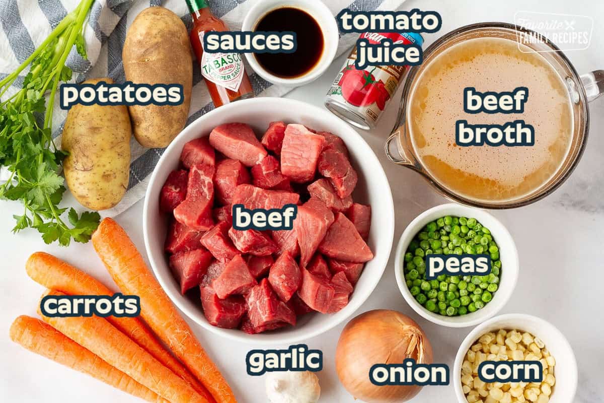 Ingredients for Hearty Beef Stew including beef, potatoes, carrots, peas, corn, onion, garlic, beef broth, tabasco, Worcestershire sauce and tomato juice.