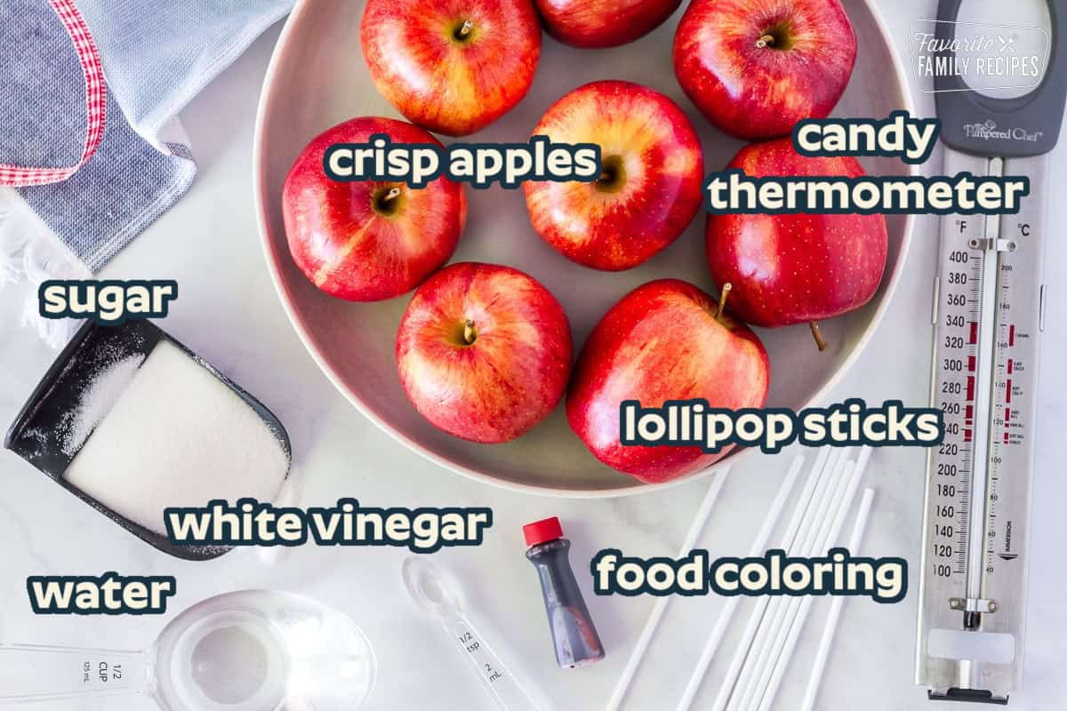 Candy Apple Recipe ingredients: apples, sugar, white vinegar, water, and red food coloring.
