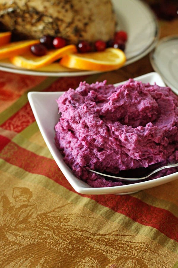 Purple Sweet Potatoes in a white serving dish.