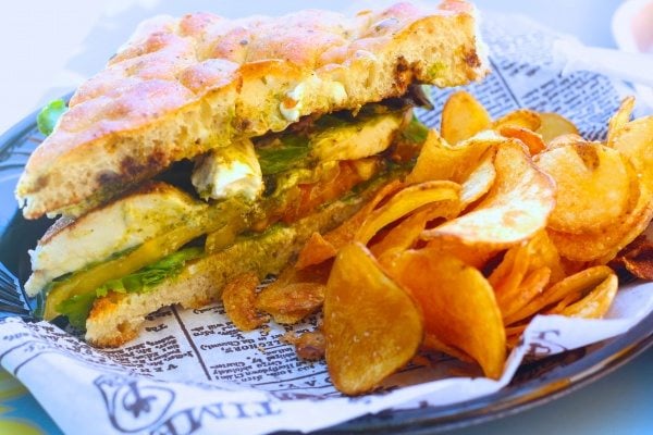 A visit to the Happiest Place on Earth wouldn't be complete without some of the most magical treats! From Dole Whip to Monte Cristos, check out our Favorite Foods at Disneyland. Sandwich with kettle chips.