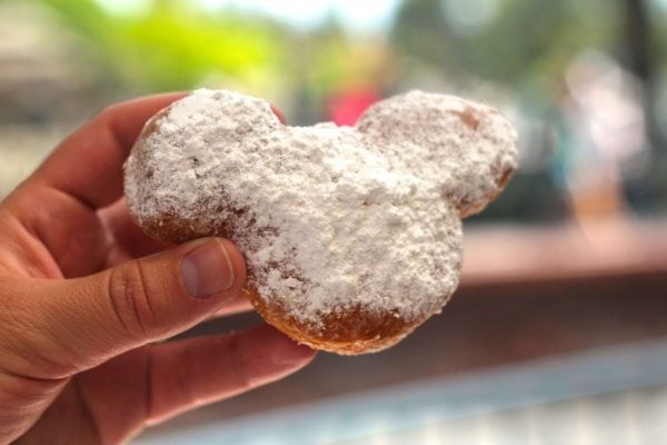 Mickey shaped beignet with powdered sugar. 