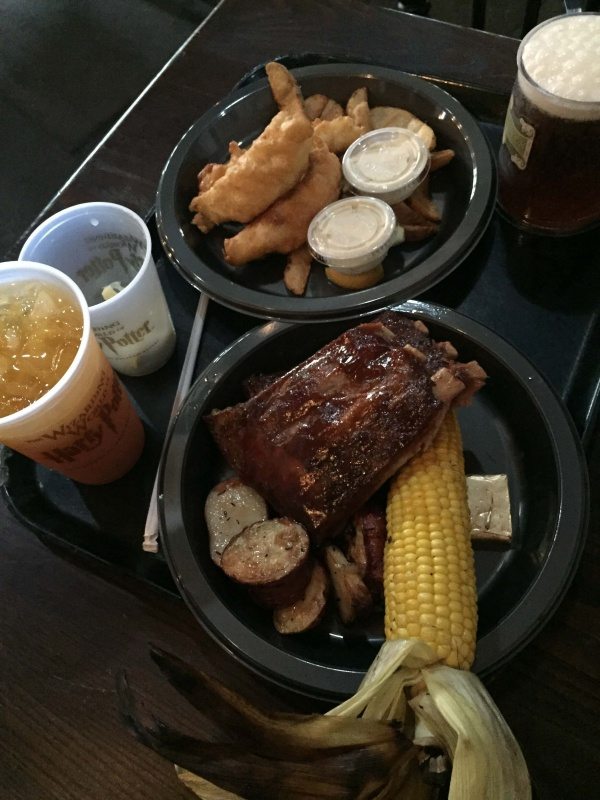 Wizarding World of Harry Potter Universal Studios Orlando meal with ribs, corn on the cob, butterbeer and pumpkin juice. 