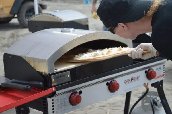 You can use it as a smoker. You can use it as a grill. You can use it for both. Cooking with the camp chef pizza maker.