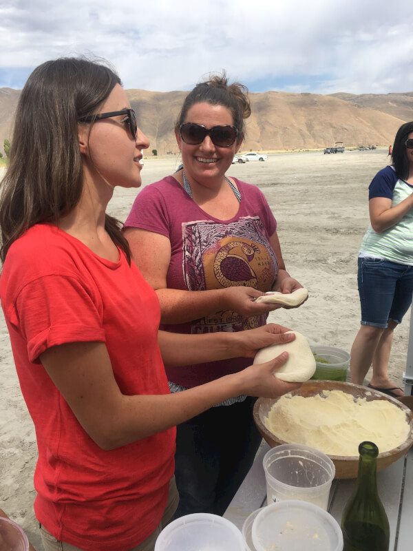 You can use it as a smoker. You can use it as a grill. You can use it for both. Erica and Natasha making dough.