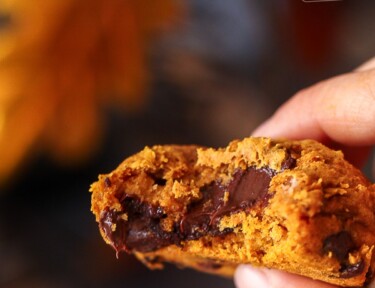 Closeup of a warm pumpkin cookie with chocolate chips