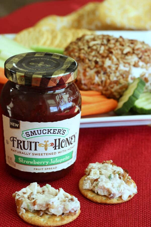 This Strawberry Jalapeño Cheese Ball is a festive holiday appetizer. Sweet strawberry jam and spicy jalapeño give it the perfect blend of sweet and heat. Strawberry Jalapeño Cheese Ball.