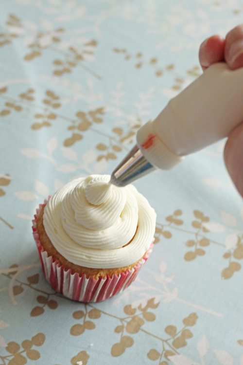 The top of a cupcake being cut out to make a hole for filling