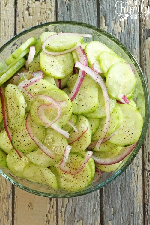 Overhead view of Easy Vinegar Marinated Cucumbers in a glass bowl.