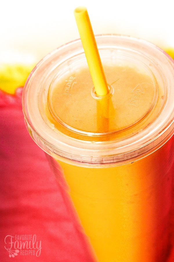 Orange Julius Copycat Drink Orange Julius in a clear cup with a straw.