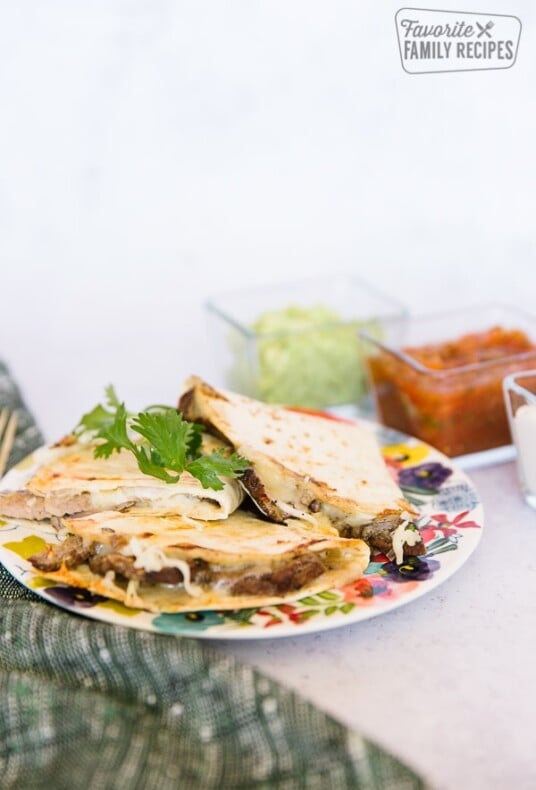 Grilled Steak Quesadillas served on a floral plate