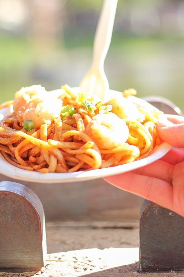 Shrimp and galic noodles with in a white bowl. 