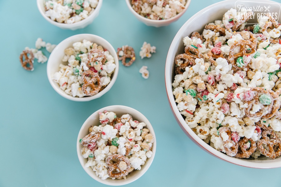 Christmas popcorn snack mix in serving bowls.