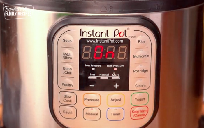 An instant pot with "On" in the settings.