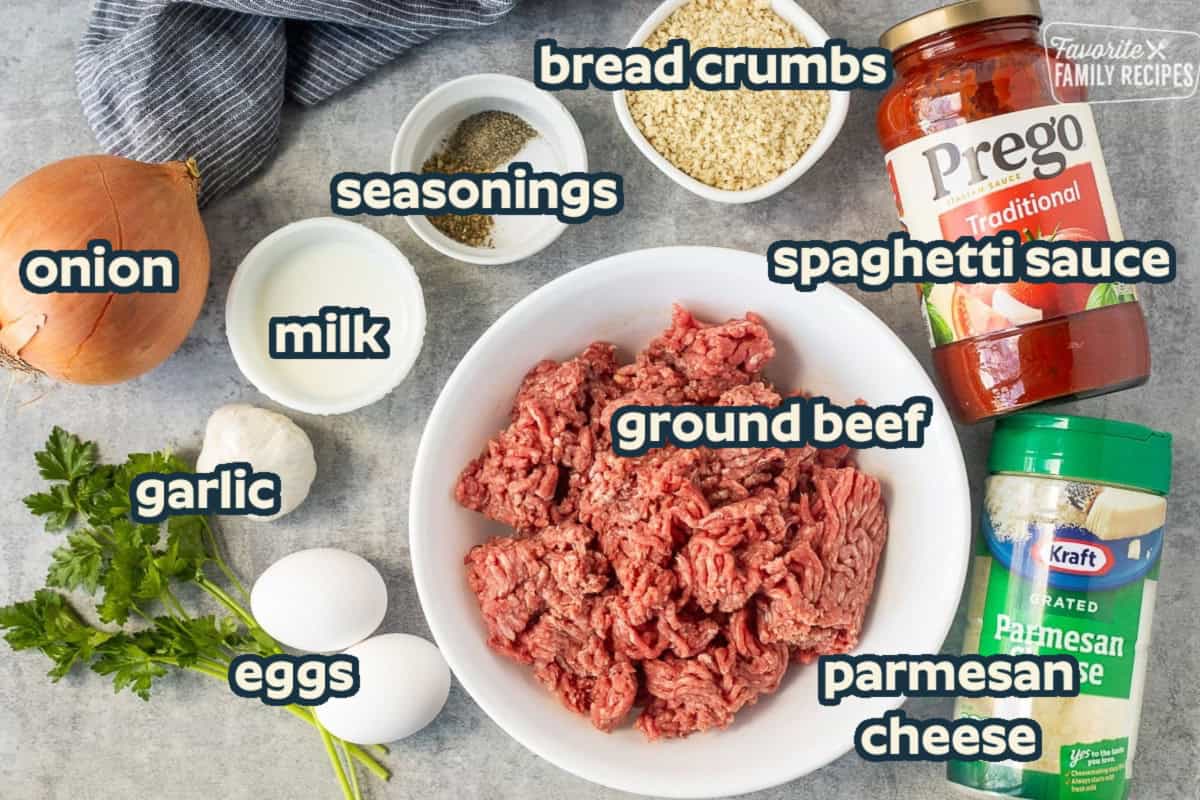 Ingredients to make instant pot meatballs including ground beef, marinara sauce, Parmesan cheese, Panko crumbs, seasonings, onion, eggs, garlic, and milk.