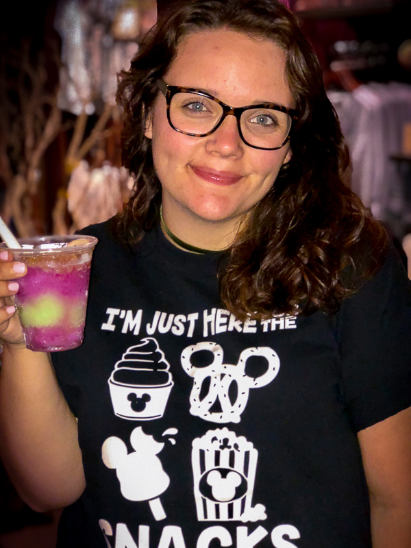 Echo's daughter holding a pink and green drink. 