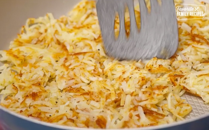 hash browns fried in a frying pan