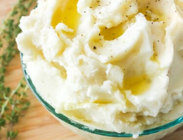 Mashed potatoes in a bowl with butter
