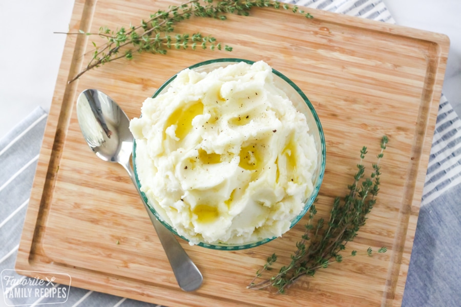 Mashed potatoes in a bowl with melted butter