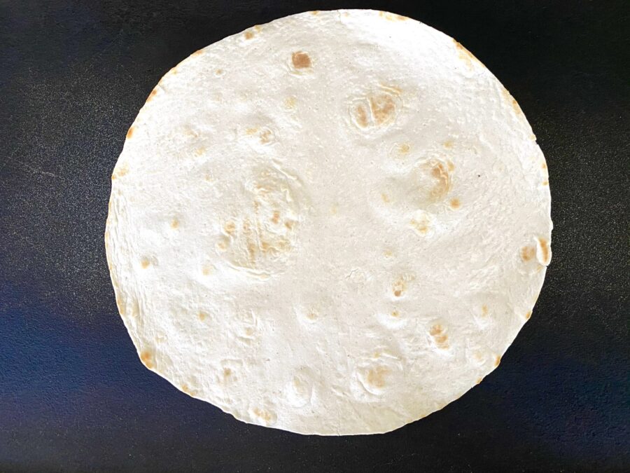 single tortilla on a griddle