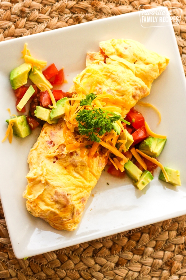 Omelette in a Bag with tomatoes, avocado, and cheese toppings