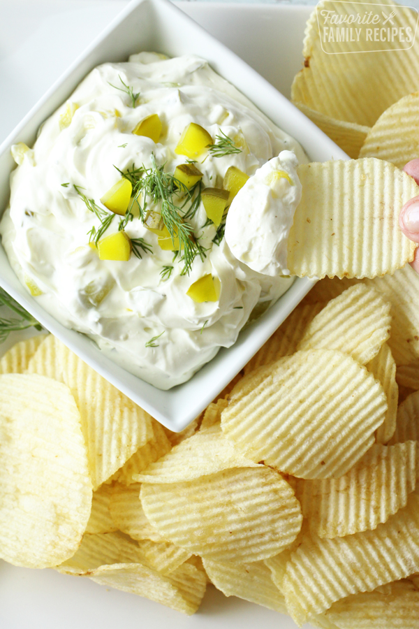 Tray of potato chips with creamy dill pickle dip
