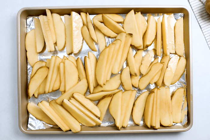 Baked Potato Wedges on a baking sheet.