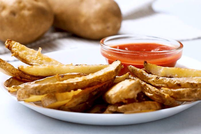 Baked Potato Wedges served with ketchup.