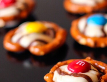 5 Pretzels with Hershey's hugs melted on top with an M&M in the middle