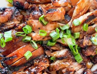 sliced grilled chicken teriyaki on a plate