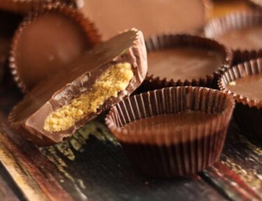homemade peanut butter cups on a wood board
