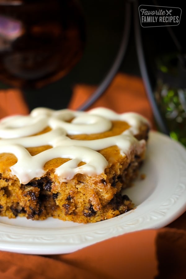 Slice of Chocolate Chip Pumpkin Sheet Cake on a white plate