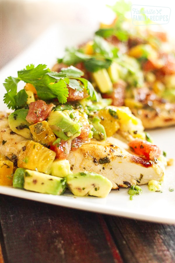 Close up of Citrus Avocado Chicken on a white tray.