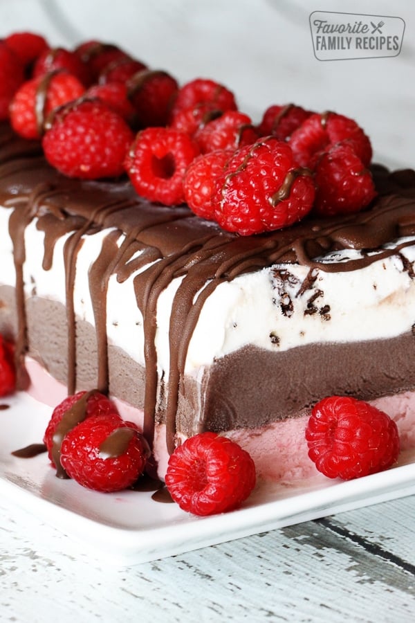 Close up of Frozen Layered Gelato Cake topped with raspberries.