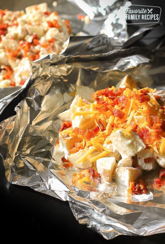 Grilled Foil Ranch Potatoes topped with bacon and cheese.