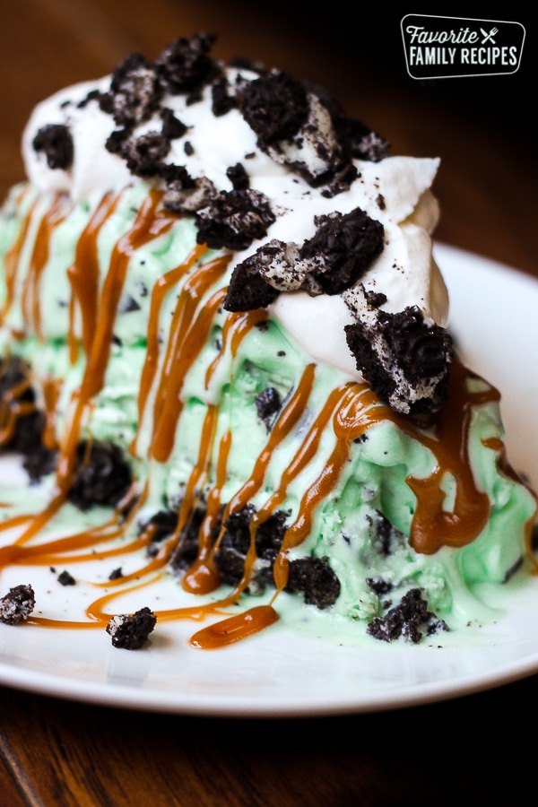 Grasshopper pie with mint chocolate chip ice cream on a white plate