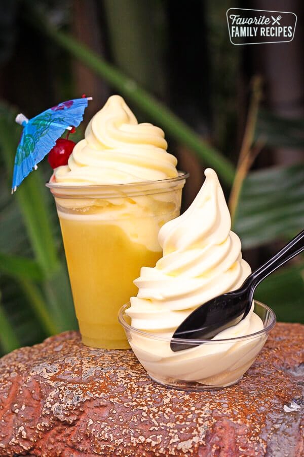 A visit to the Happiest Place on Earth wouldn't be complete without some of the most magical treats! From Dole Whip to Monte Cristos, check out our Favorite Foods at Disneyland. A dole whip with a spoon in front of another dole whip smoothie.