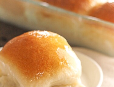Pani Popo in a pan with a single slice on a plate.