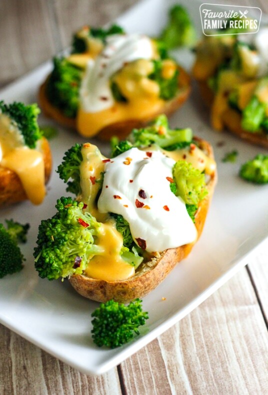 Broccoli Cheese Stuffed Potato Skins on a white plate.