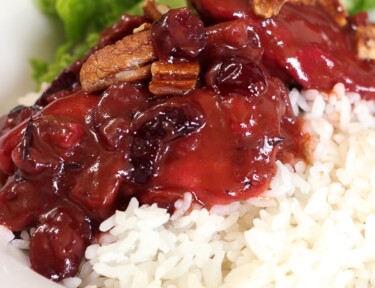Cranberry Chicken over white rice with salad on the side.