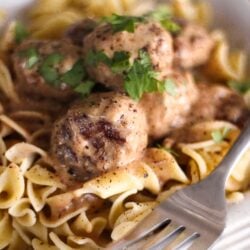 Easy Meatball Stroganoff in a bowl with a fork on the side.