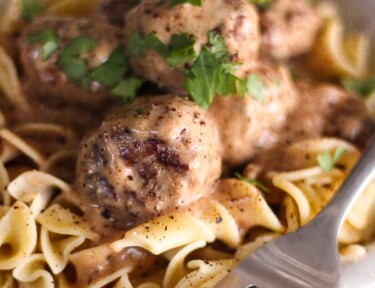 Easy Meatball Stroganoff in a bowl with a fork on the side.