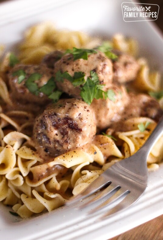 Easy Meatball Stroganoff in a bowl with a fork on the side.
