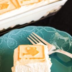 slice of four layer banana cream dessert on a plate